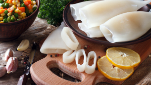 Preparation of raw squid and ingredients close-up. Horizontal