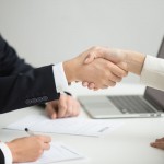 Hr handshaking successful candidate getting hired at new job, closeup